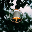 The white Poldina Pro Suspension Magnetic from Zafferano used for a garden party.