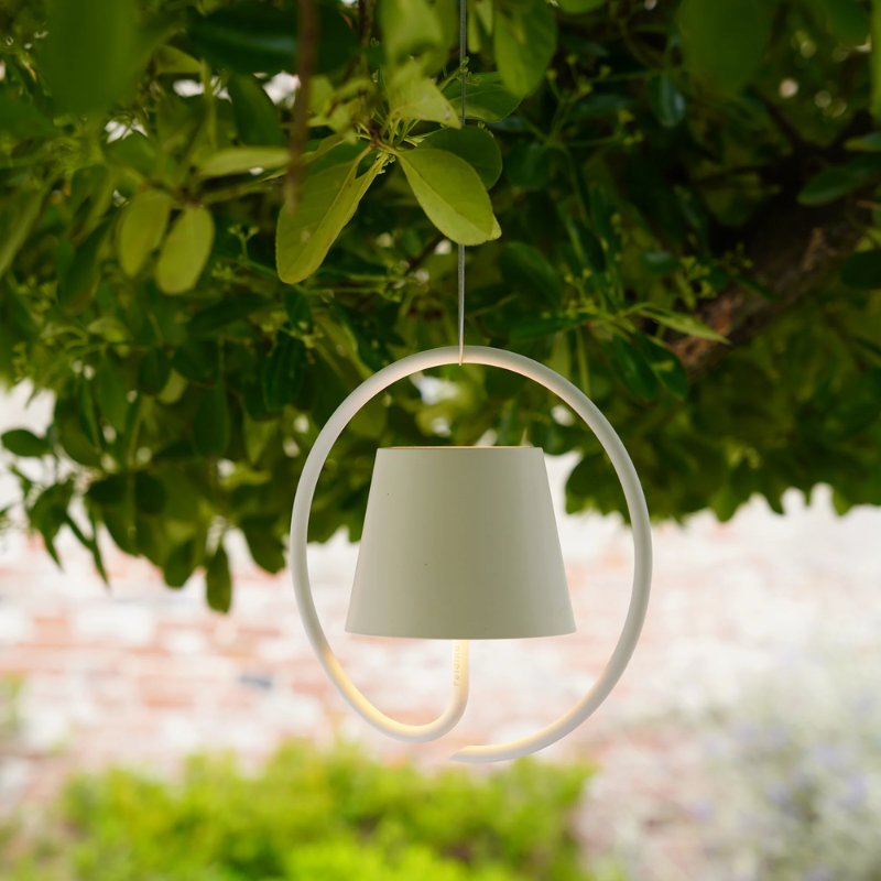 The white Poldina Pro Suspension Magnetic from Zafferano in an outdoor living area.