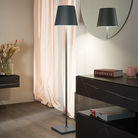 The dark gray Poldina Pro XXL Floor Lamp from Zafferano in a primary bedroom.