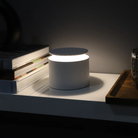 The white PushUp Pro from Zafferano on a bedside table.