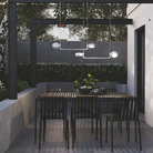 The white Super O Hanging Lamp from Zafferano outdoors in a dining area. all-groups