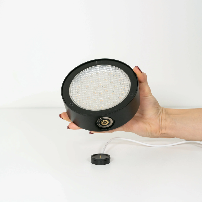 The black Super O Suspended Floor Lamp from Zafferano light module.