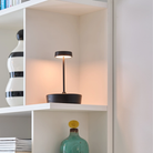 The black Swap Pro Mini from Zafferano in a lounge.