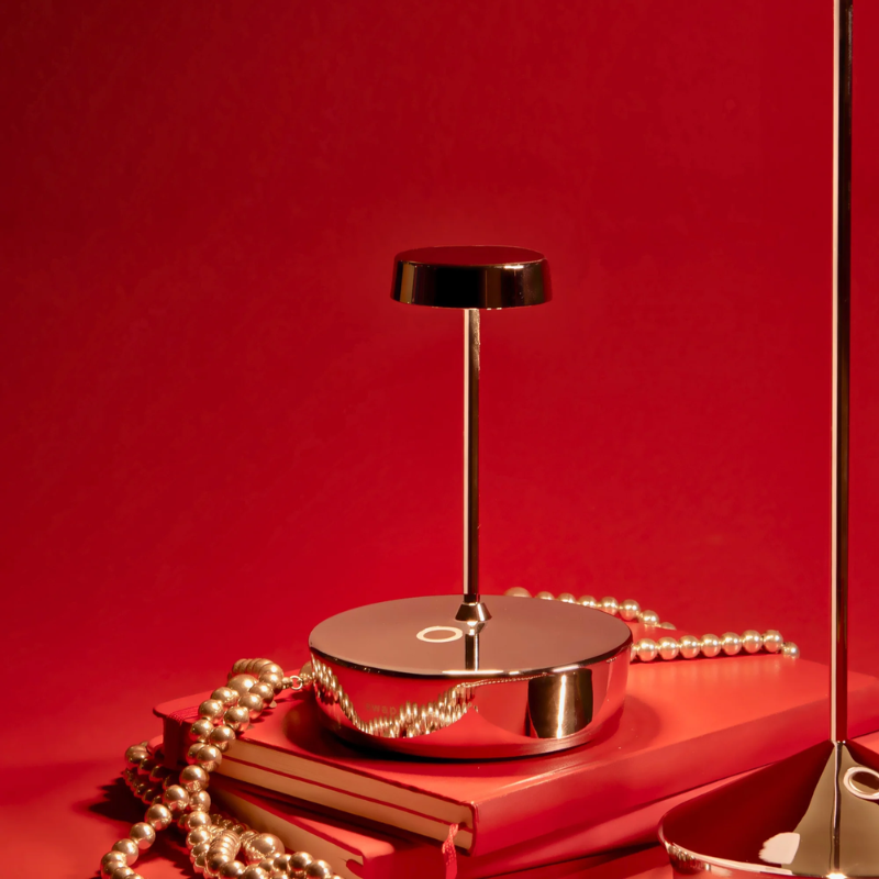 The glossy chrome Swap Pro Mini from Zafferano in a living area.