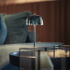 The polished chrome Theta Pro from Zafferano in a den.