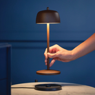 The rust Theta Pro from Zafferano, a portable lamp.