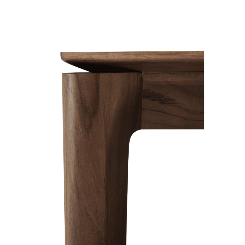 The Bok Dining Table from Ethnicraft in brown teak, close-up.