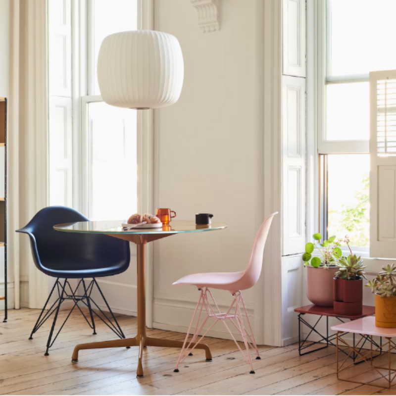 The Eames Dining Table from Herman Miller, designed by Herman Miller x Hay indoors inside of a dining room.