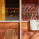 The Eames Hang-It-All rack from Herman Miller, designed by Herman Miller x Hay in a lifestyle photograph withe other Eames collection products.