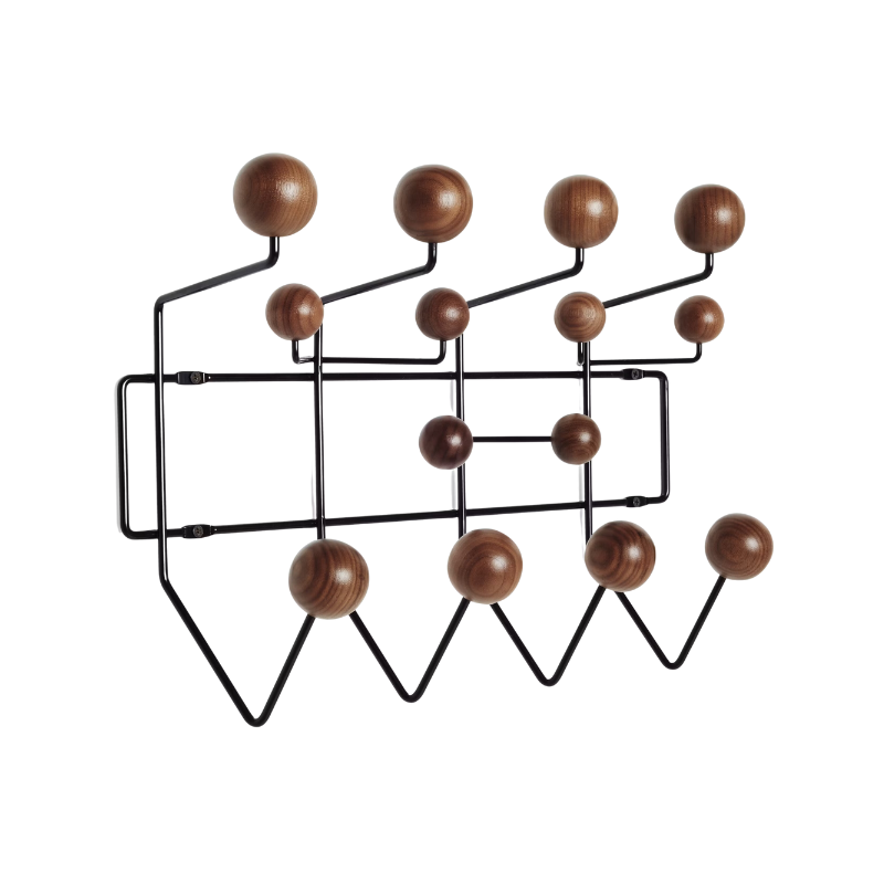 The Eames Hang-It-All, originally released in 1953, exemplifies the Eameses' belief in taking pleasure seriously. Made with a sturdy steel frame and solid wood balls, this colorful coat rack was created using the same technique for simultaneously welding wires that Charles and Ray developed for their low tables and wire chairs.