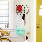 The Eames Hang-It-All from Herman Miller next to a doorway.