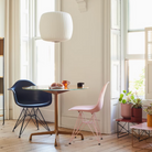 The Eames Molded Plastic Side Chair from Herman Miller designed by Herman Miller x HAY in a living room space.