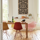 The Eames Molded Plastic Side Chair from Herman Miller designed by Herman Miller x HAY in a dining room. all-groups