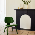 The Eames Molded Plywood Lounge Chair by Herman Miller, designed by Herman Miller x HAY in a living room lifestyle photograph.