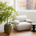 The Eames Turned Stool from Herman Miller in a den.