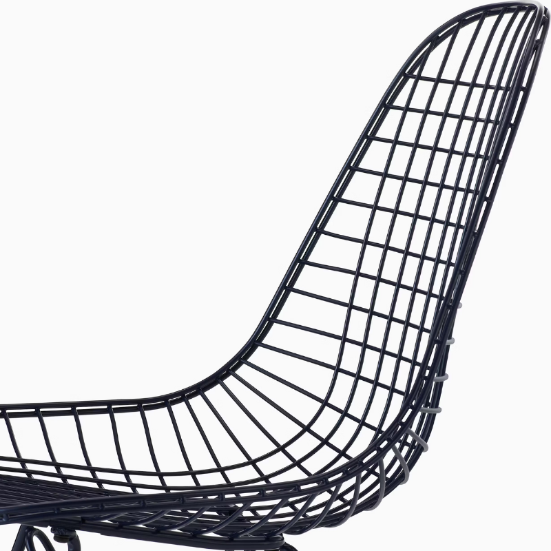 The Eames Wire Chair from Herman Miller, designed by Herman Miller x HAY in black blue with a close up on the seat.