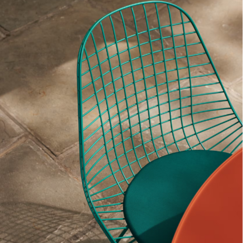 The Eames Wire Chair from Herman Miller, designed by Herman Miller x HAY with a seat pad close up.