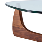 The Noguchi Table from Herman Miller in walnut in a close up shot of the leg.