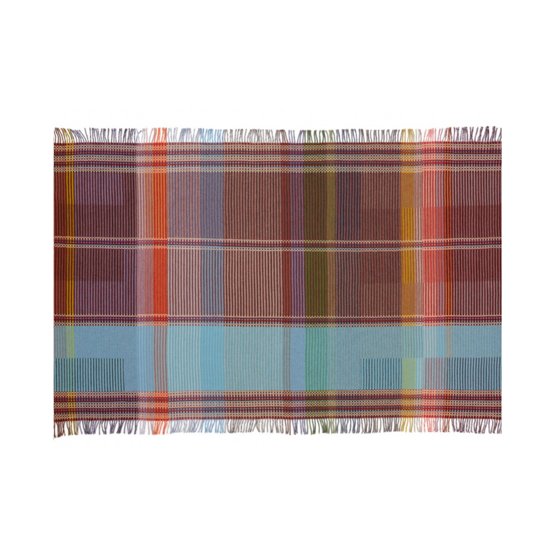 The Beatrix Throw by Wallace & Sewell is made of woven merino lambswool. The Pinstripe collection combines bold-colored blocks with fine, detailed vertical stripes. This double-sided design also has a contrasting pixelated border and is a stunning room addition