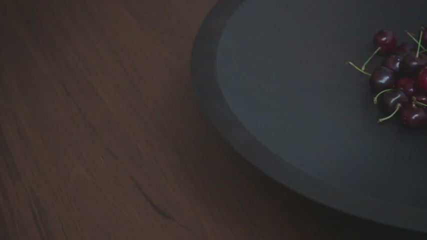The Satellite Bowl from Ethnicraft in a promotional video showing the product in a dining room, on top of a dining table.