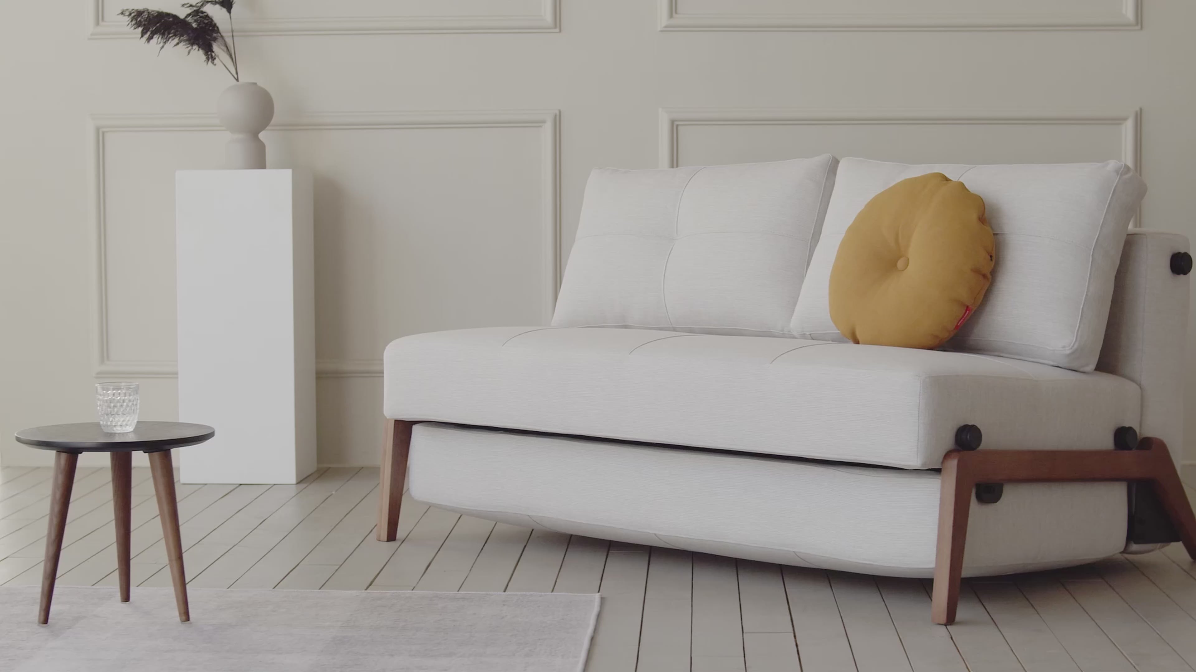 The Cubed Queen Size Bed with dark wood legs - instructional video on how to convert it from a sofa to a bed. all-groups.