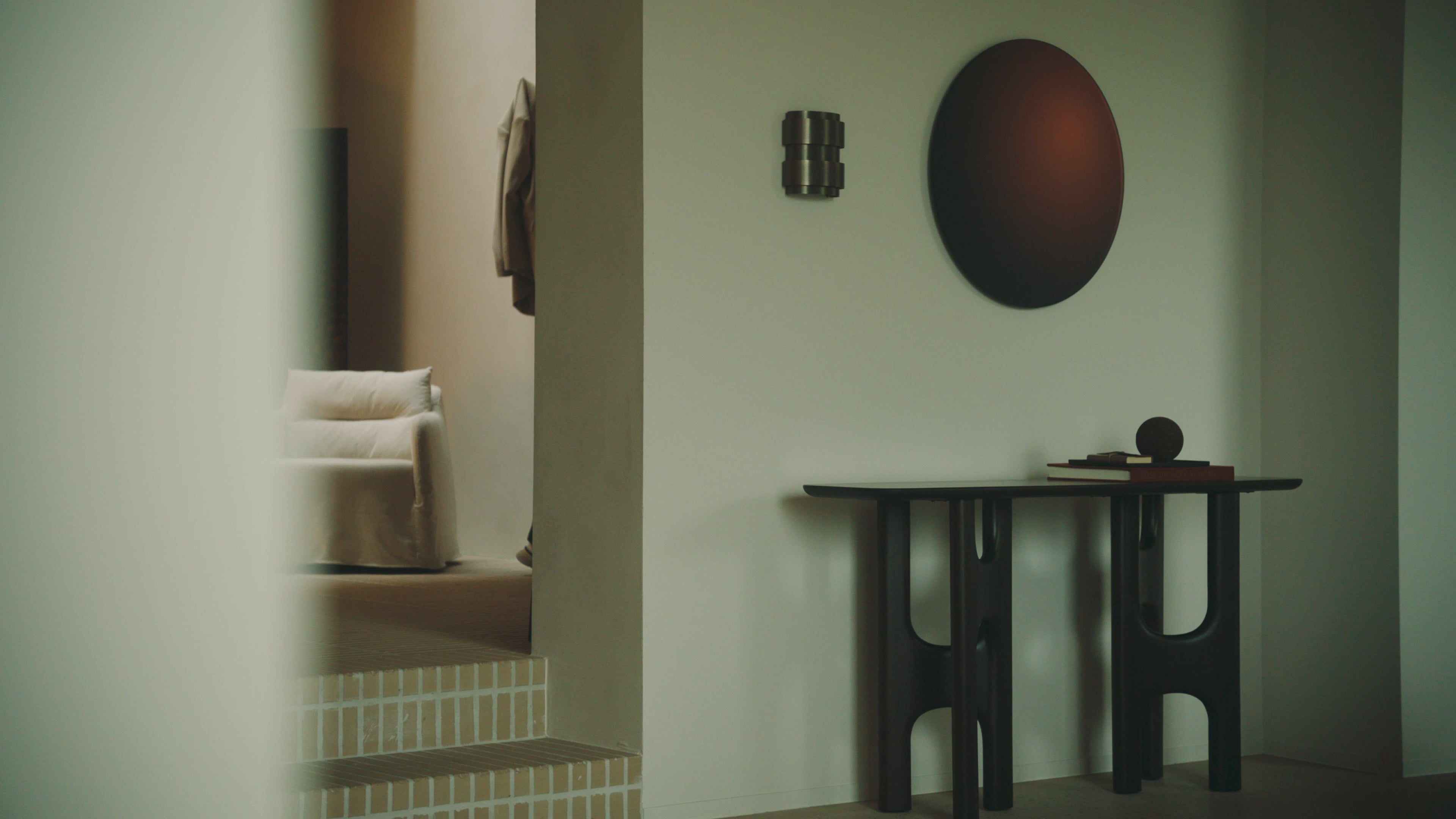 The Flow Console from Ethnicraft in a video living space.