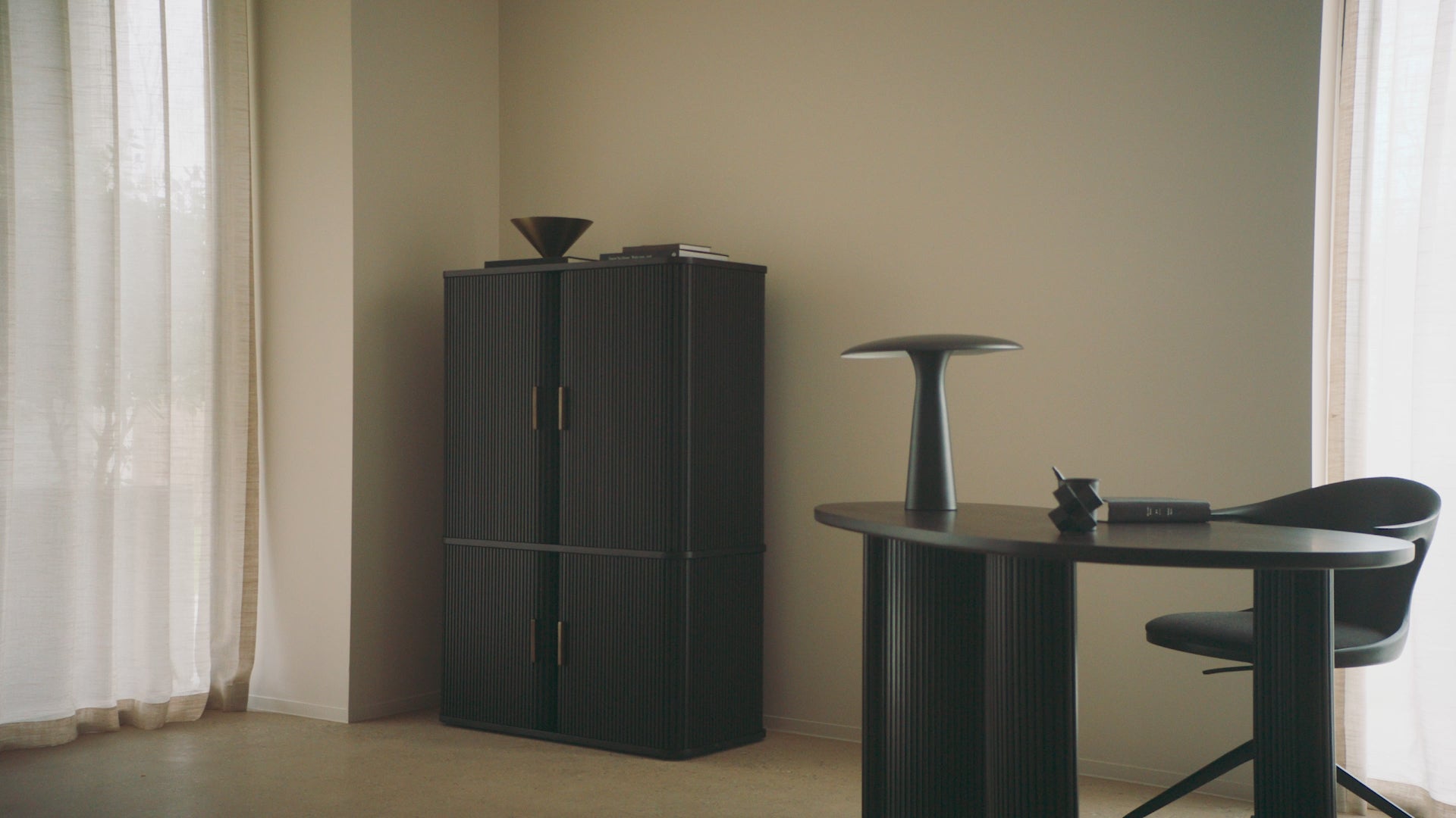 The Roller Max Filing Cabinet from Ethnicraft in a living room.