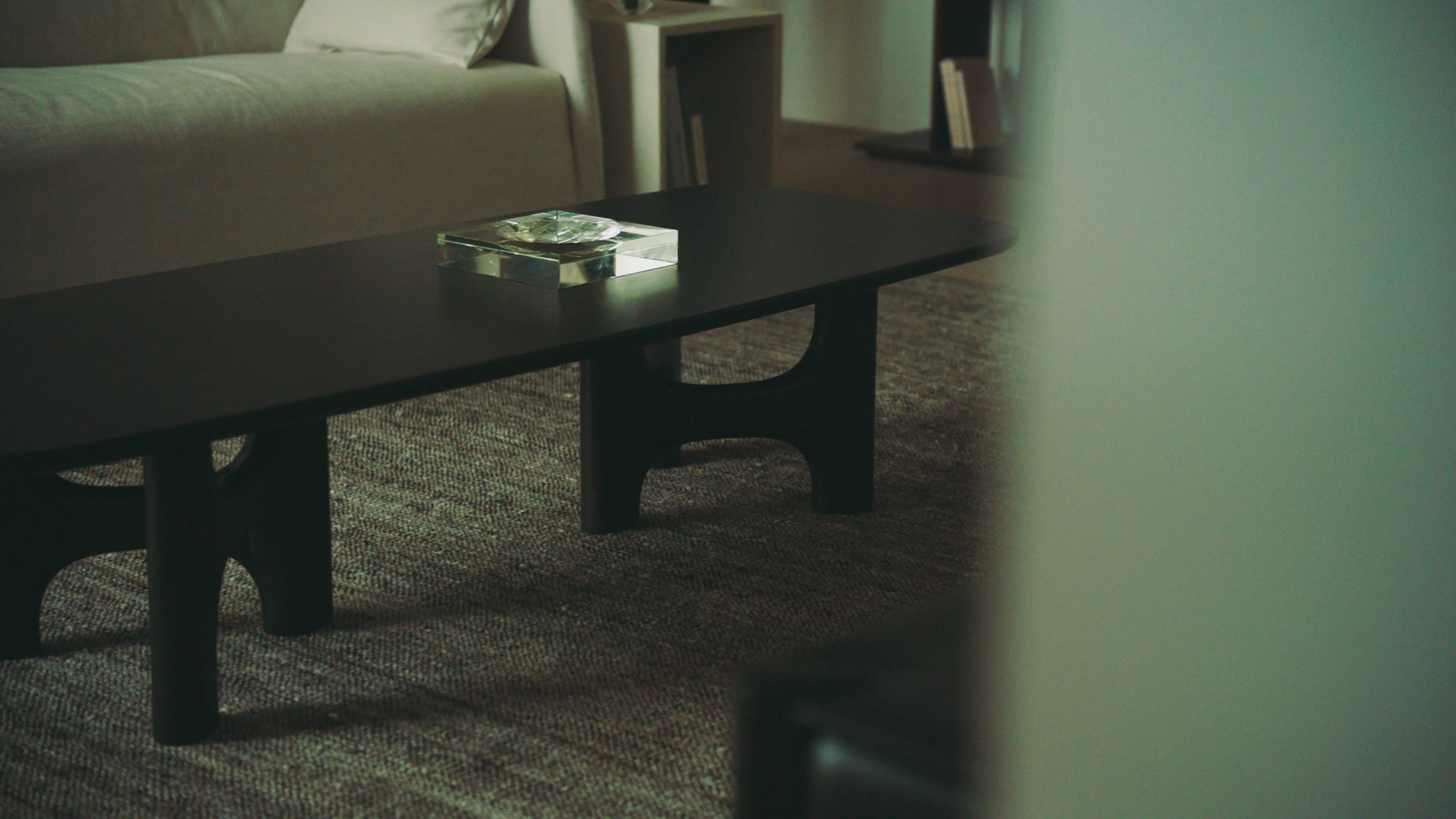 The Flow Coffee Table from Ethnicraft shown on video in a living room.