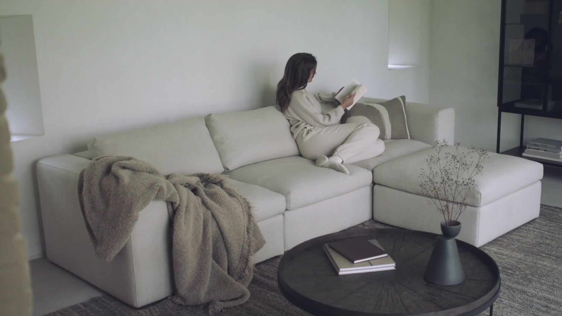 A video showing the Mellow Sofa from Ethnicraft, including the footstool. 