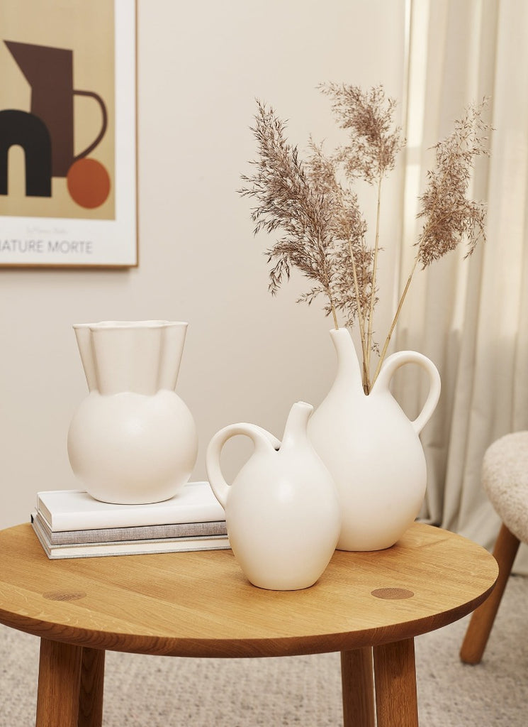 The Sweeping Top Vase by Spring Copenhagen was designed by Eva Stæhr-Nielsen, who, during her career was awarded numerous international design prizes in Milan, Paris, Tokyo and the United States, among many others. Today, her stoneware design is much sought after by collectors all over the world. 