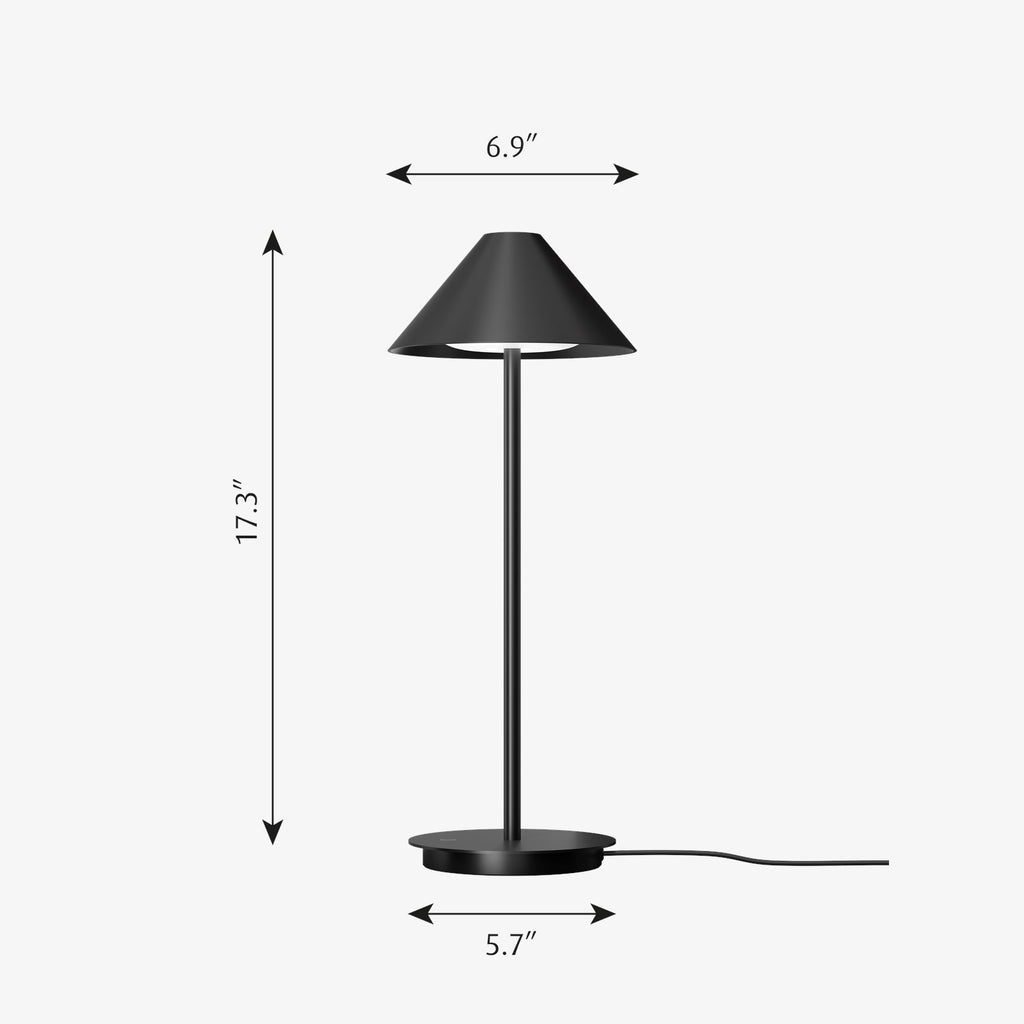 The Keglen table lamp’s distinctive conical shade has a built-in curved diffuser. This ensures an attractive and glare-free downwardly directed light. The stem morphs into the diffuser shade, folding inward and creating a beautiful organic geometry. A gentle light is also emitted upward through a discreet uniform opening in the top of the shade to create a perfect ambiance. Designed by Jakob Lange.