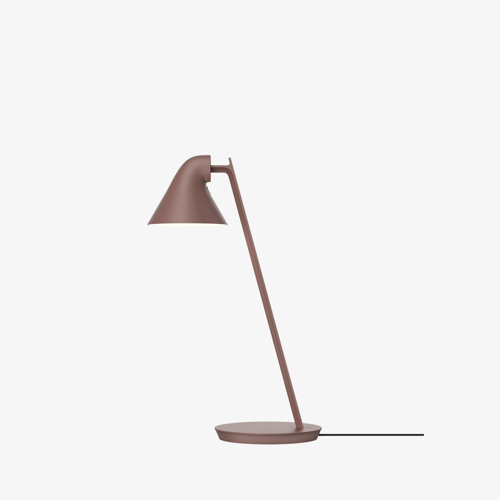The NJP Mini Table Lamp is a petite version of the NJP Table Lamp with downscaled proportions. Both are a modernistic take on the classic architect lamp with the flexibility of two joints on the extensive arm. The characteristic rear-shade opening toward the arm allows stemless adjustment of the organic head. Designed by Nendo Japanese design studio and designer Oki Sato. 