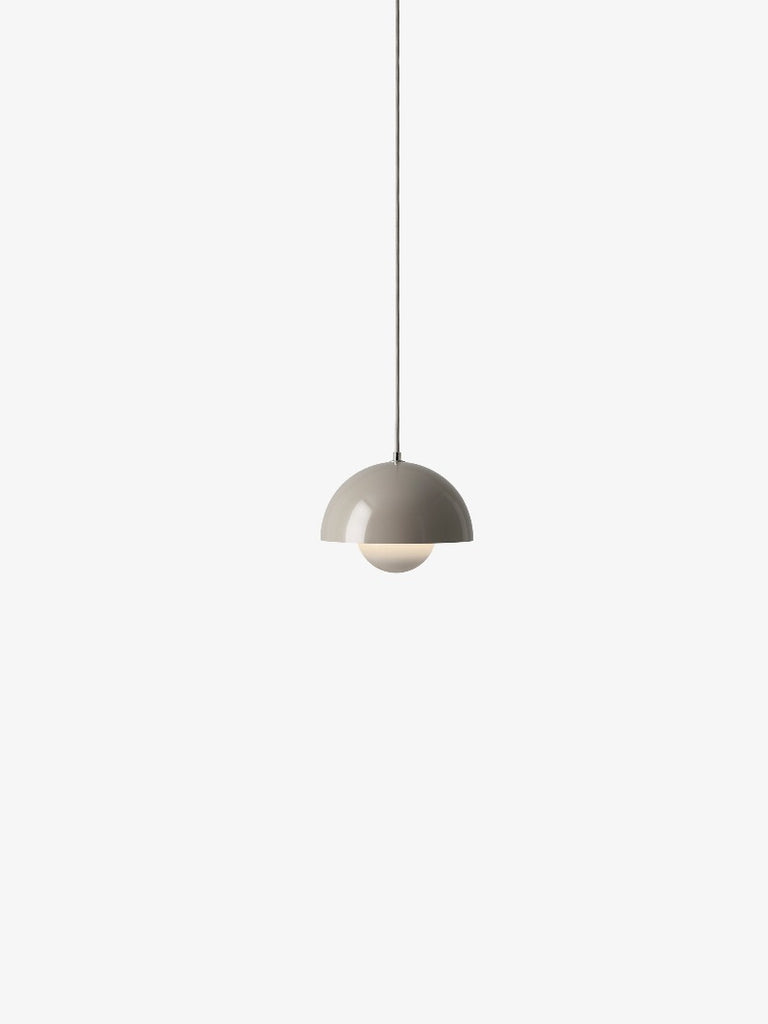 The Flowerpot VP1 Mini Pendant Light by Verner Panton became synonymous with the Flower Power movement from the late 60s. Reflecting a break from convention to embrace a more open, modern mentality that promoted peace and harmony. Such was the mindset of its designer, Verner Panton. One of the most forward-thinking talents of his time. The Flowerpot series consists of several different models, including three pendants and two table lamps - all in a wide range of colors.