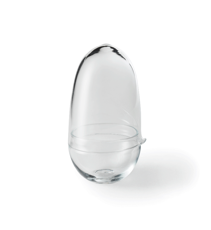 Caroline Wetterlings Grow is made of two glass parts. The bottom part holds the soil and the plant. The top part is a lid equipped with a spout, allowing it to be used as a watering can. It also functions as a valve that lets in air and regulates the moisture and temperature levels inside the greenhouse. Grow is made of hand
