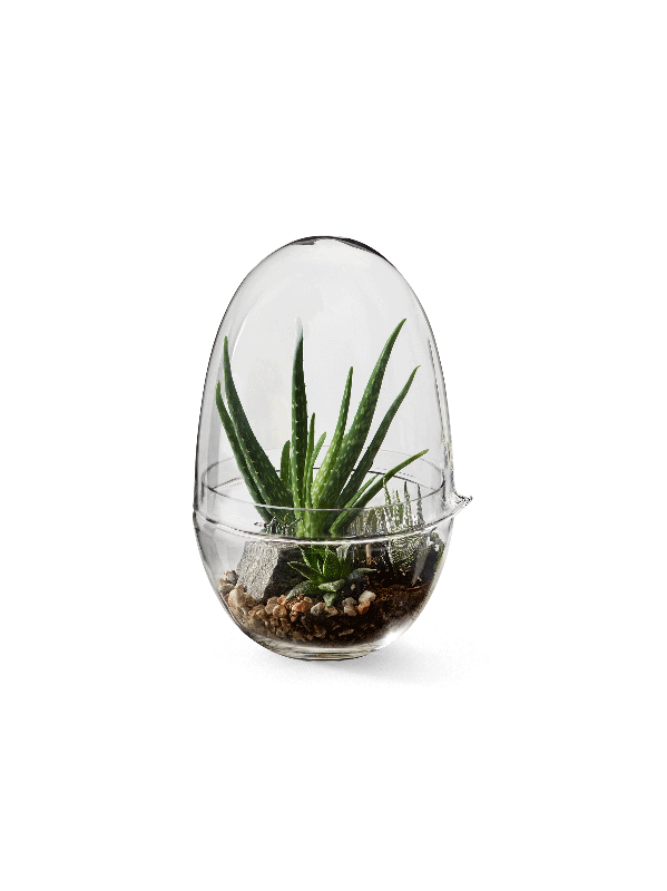 Caroline Wetterlings Grow is made of two glass parts. The bottom part holds the soil and the plant. The top part is a lid equipped with a spout, allowing it to be used as a watering can. It also functions as a valve that lets in air and regulates the moisture and temperature levels inside the greenhouse. Grow is made of hand
