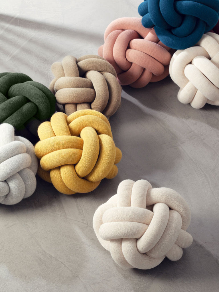 A cushion with a unique character, based on sculptural form instead of patterns. Knot is made from a knitted tube, several meters in length, which is then tied up to create a compact knot which is as comfortable as a support in the sofa as it is elegant to behold. Thanks to its strong design, Ragnheiður Ösp Sigurðardóttir’s Knot cushion belongs to the exclusive group of products that remain in one’s memory. 