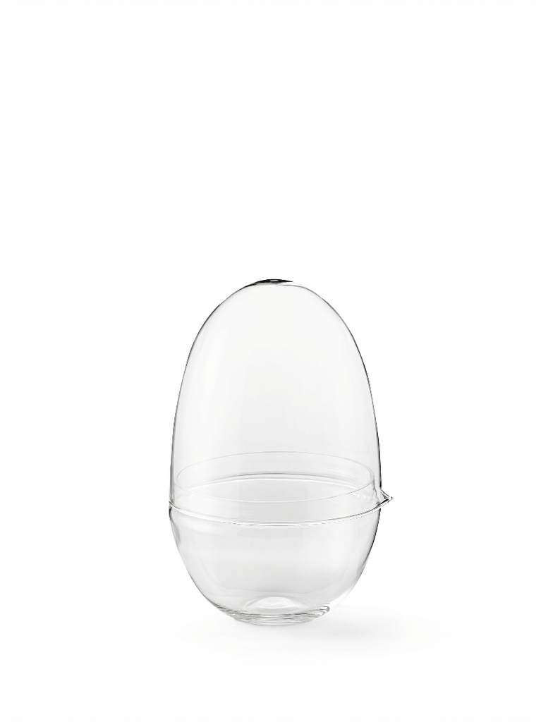 Caroline Wetterlings Grow is made of two glass parts. The bottom part holds the soil and the plant. The top part is a lid equipped with a spout, allowing it to be used as a watering can. It also functions as a valve that lets in air and regulates the moisture and temperature levels inside the greenhouse. Grow is made of hand