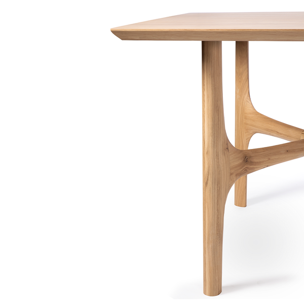 The Nexus Dining Table by Ethnicraft is brought to life by creating flow and movement. There is a certain subtle transition going from shape to shape within the design of the table. A single line that was almost instinctively sketched on paper in the early stages of the design process. All elements are seamlessly merged together bringing warmth to any dining room. 