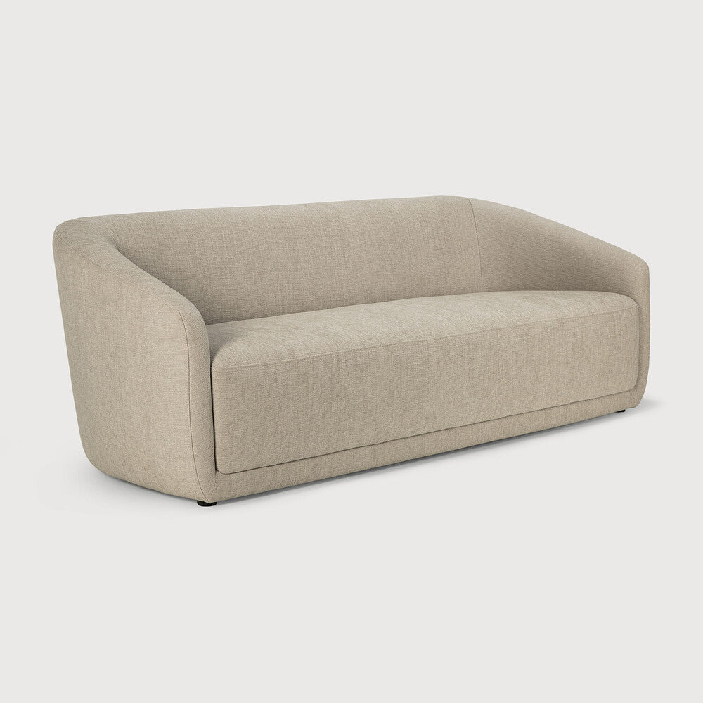 The Trapeze Three Seater Sofa by Jacques Deneef for Ethnicraft. Geometric, straight and clean lines: Trapeze is a statement of classic minimalism. Accumulate cushions to style it as you wish, like a blank canvas on which you can let your inspiration flow. This nonchalant lounge sofa will fit into any style, whether that be in an urban flat or a country homestead. 