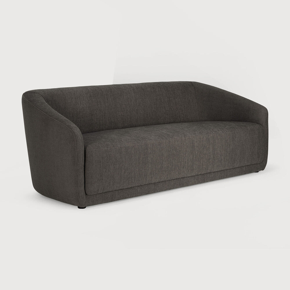 The Trapeze Three Seater Sofa by Jacques Deneef for Ethnicraft. Geometric, straight and clean lines: Trapeze is a statement of classic minimalism. Accumulate cushions to style it as you wish, like a blank canvas on which you can let your inspiration flow. This nonchalant lounge sofa will fit into any style, whether that be in an urban flat or a country homestead.