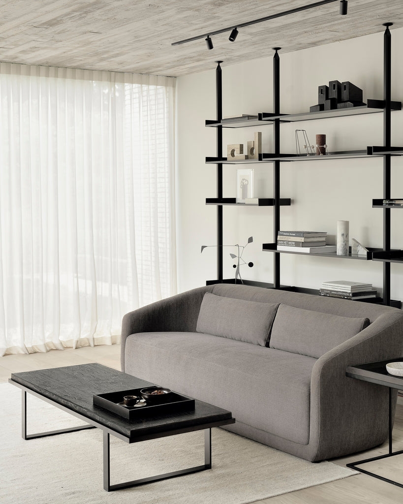 The Trapeze Three Seater Sofa by Jacques Deneef for Ethnicraft. Geometric, straight and clean lines: Trapeze is a statement of classic minimalism. Accumulate cushions to style it as you wish, like a blank canvas on which you can let your inspiration flow. This nonchalant lounge sofa will fit into any style, whether that be in an urban flat or a country homestead.