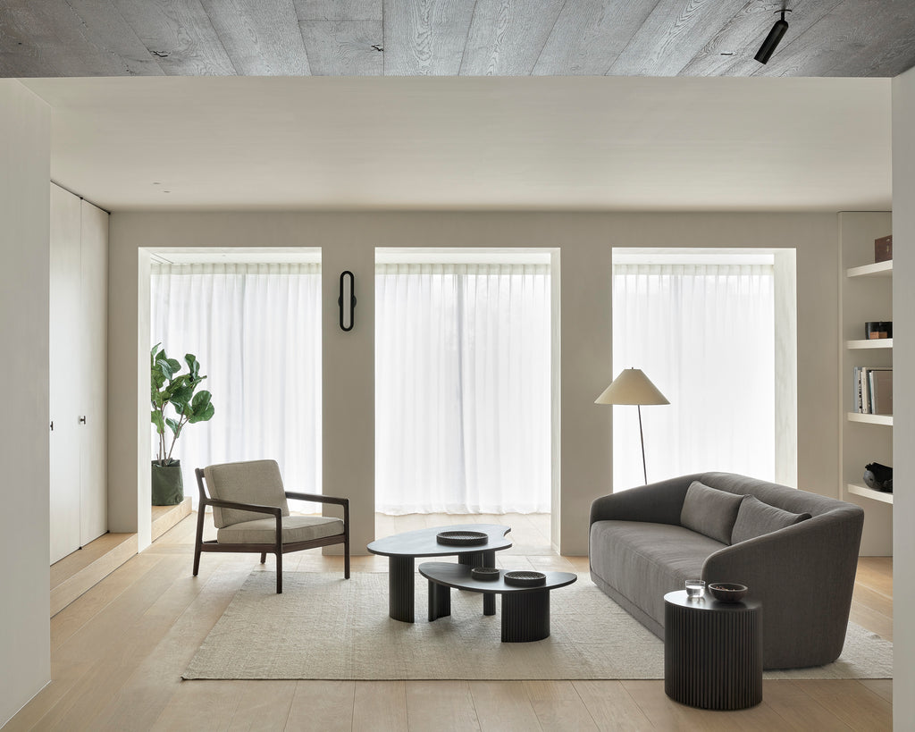The Trapeze Three Seater Sofa by Jacques Deneef for Ethnicraft. Geometric, straight and clean lines: Trapeze is a statement of classic minimalism. Accumulate cushions to style it as you wish, like a blank canvas on which you can let your inspiration flow. This nonchalant lounge sofa will fit into any style, whether that be in an urban flat or a country homestead.