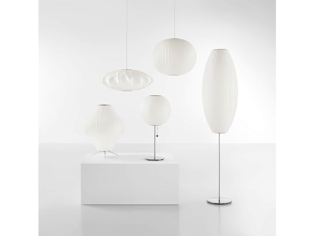 The Nelson Cigar Lotus Floor Lamp, an elongated shade set on a steel lamp stand, illuminates any room with a warm glow. Available in two elegant finishes. Apart of the  timeless Nelson Bubble Lamps series, designed in 1952, beautifully complement contemporary interiors.