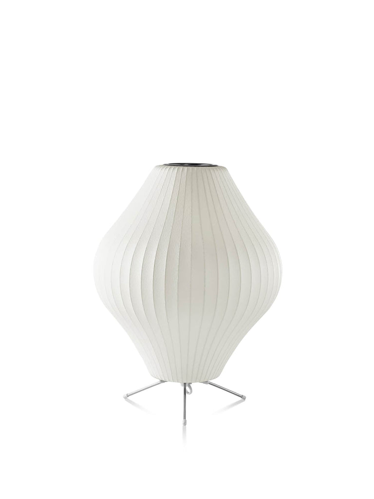 The Nelson Pear Tripod Table Lamp, a flared, pear-shaped shade set on a steel tripod base, emits warm, diffused light. The timeless Nelson Bubble Lamps, originally designed in 1952, complement contemporary interiors as beautifully as they do mid-century homes.