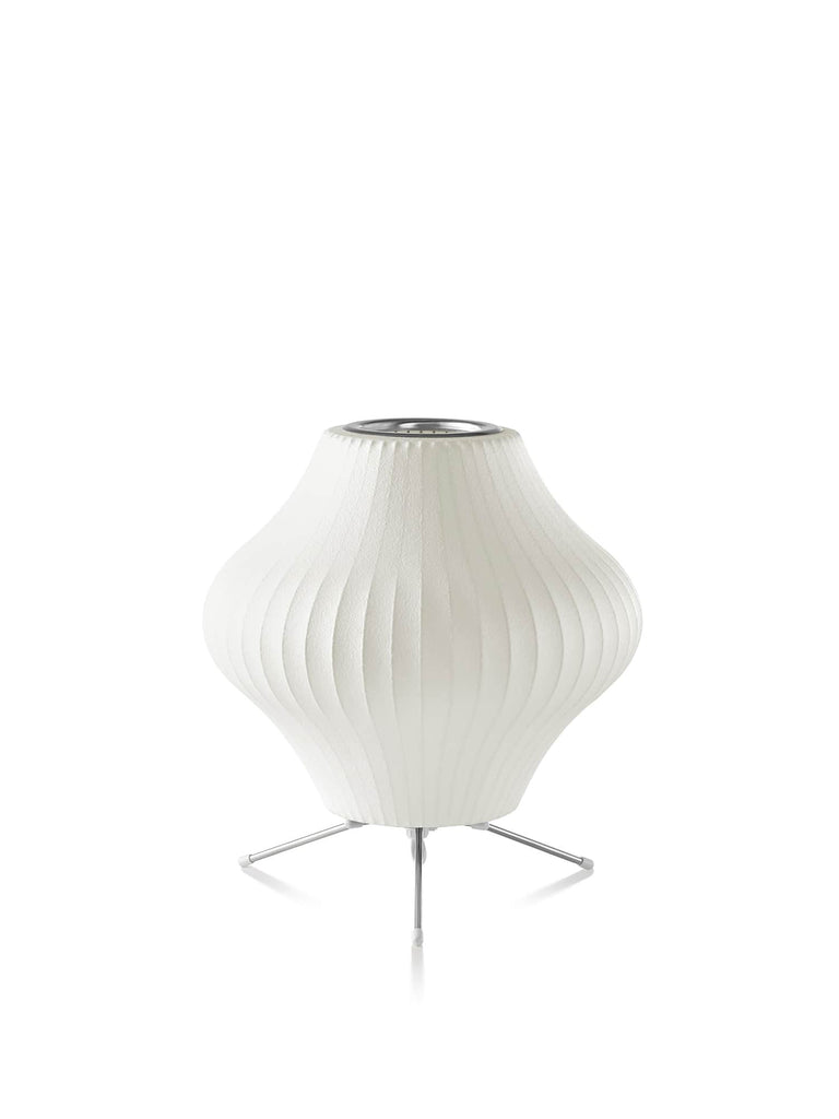 The Nelson Pear Tripod Table Lamp, a flared, pear-shaped shade set on a steel tripod base, emits warm, diffused light. The timeless Nelson Bubble Lamps, originally designed in 1952, complement contemporary interiors as beautifully as they do mid-century homes.