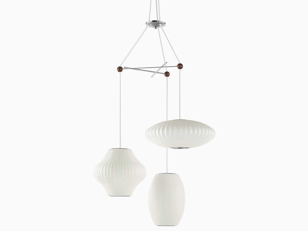 The Nelson Triple Bubble Lamp Fixture by George Nelson for Herman Miller is the  perfect solution to hang your three favorite Bubble Pendants from the designer's Bubble Lamp Series. The fixture is made up of three crossing metal rods fused together with wooden spheres to create a playful display for illumination in a space. Each Bubble lamp can be installed with up to nineteen inches of diameter. Fixture only, pendants sold separately.