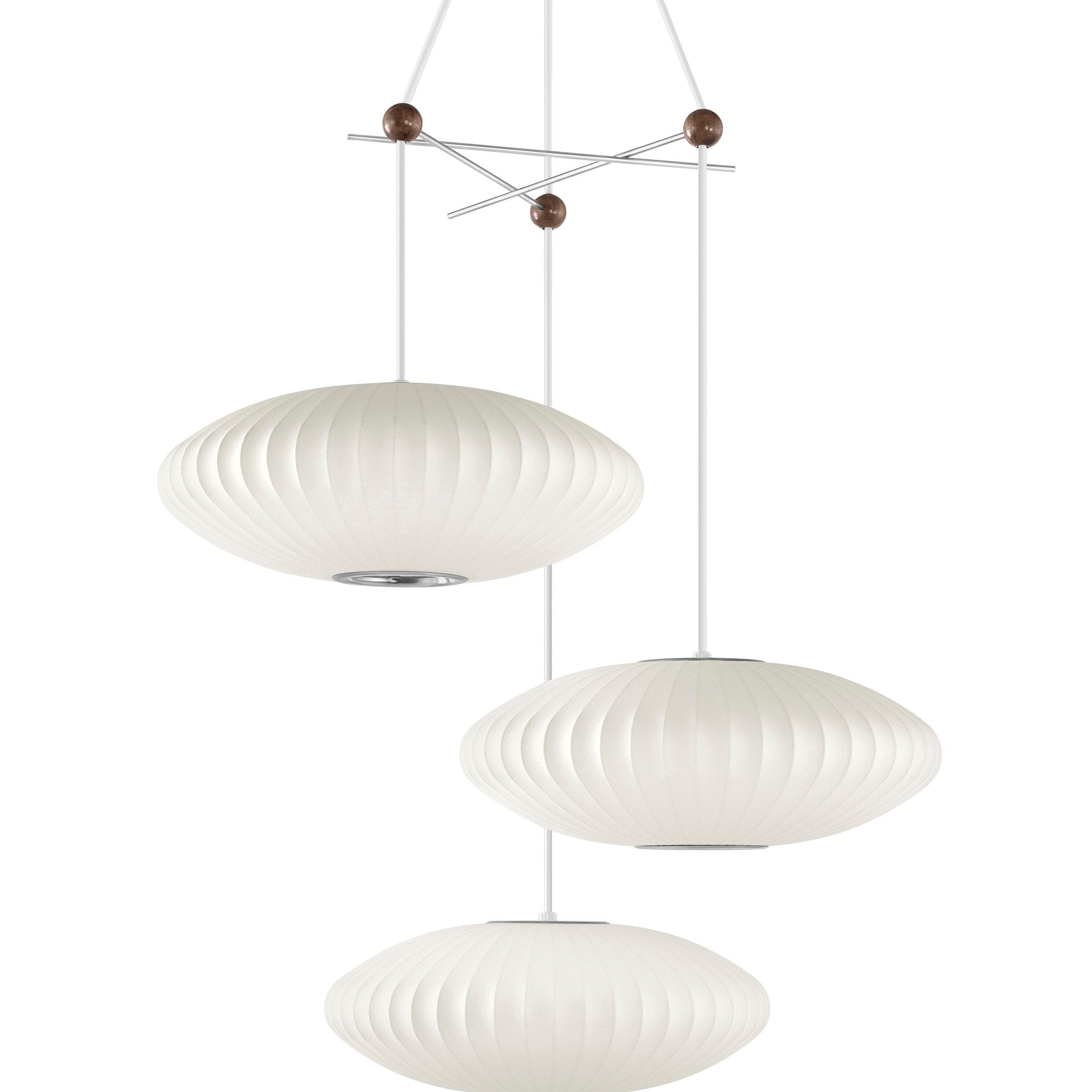 The Nelson Triple Bubble Lamp Fixture by George Nelson for Herman Miller is the  perfect solution to hang your three favorite Bubble Pendants from the designer's Bubble Lamp Series. The fixture is made up of three crossing metal rods fused together with wooden spheres to create a playful display for illumination in a space. Each Bubble lamp can be installed with up to nineteen inches of diameter. Fixture only, pendants sold separately.