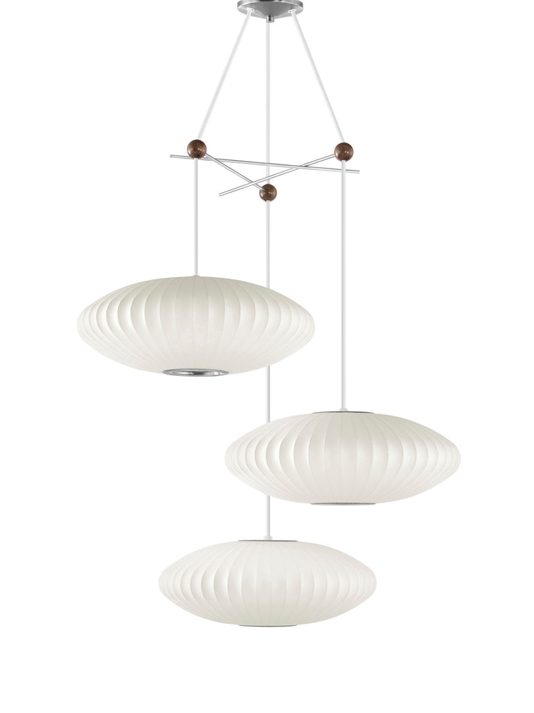 The Nelson Triple Bubble Lamp Fixture by George Nelson for Herman Miller is the  perfect solution to hang your three favorite Bubble Pendants from the designer's Bubble Lamp Series. The fixture is made up of three crossing metal rods fused together with wooden spheres to create a playful display for illumination in a space. Each Bubble lamp can be installed with up to nineteen inches of diameter. Fixture only, pendants sold separately.