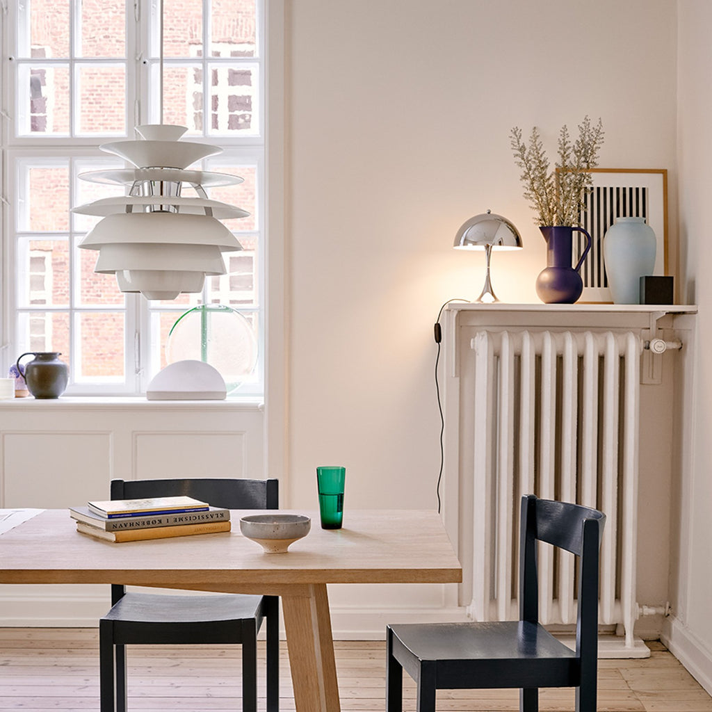 The PH Snowball fixture emits comfortable glare-free diffused light. Matte painted undersurfaces and glossy top surfaces result in an attractive reflection of the diffused light, creating uniform light distribution around the fixture. When the light is switched on, the top portion is illuminated while the bottom part remains dark.