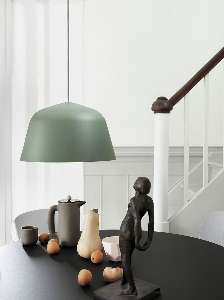 Embodying the values of Scandinavian design, the Ambit Pendant Lamp by Muuto is as timeless as it is contemporary. Made of hand-spun aluminum that has been hand-painted, the Ambit Pendant Lamp features clean lines and a white interior that heighten contrasts of its outside shade while enhancing the light emitted in any room of a home, office or commercial space. Use the design on its own or symmetric formations and vibrant clusters.